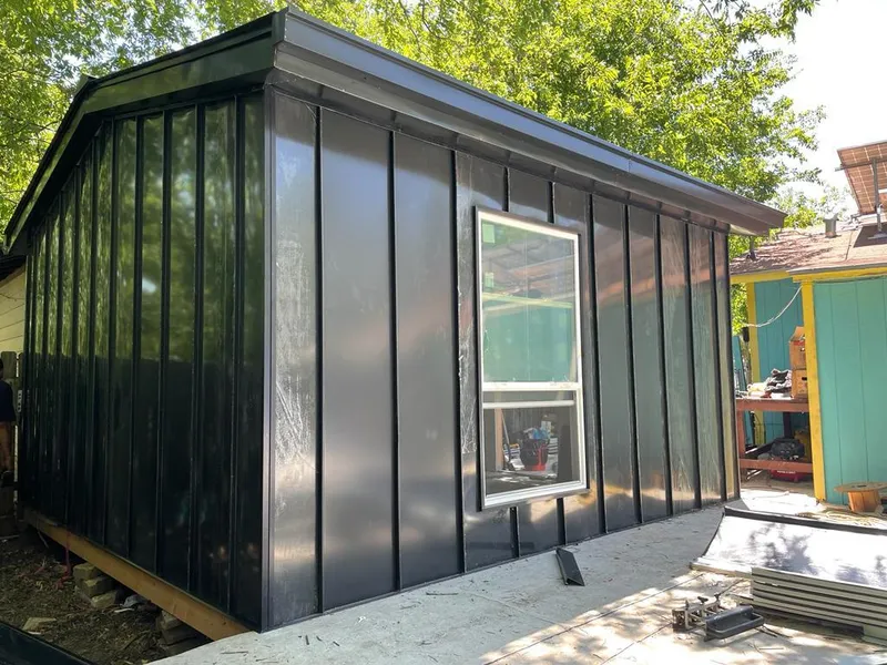 Black standing seam metal wall panels for Roof Inspection in Arlington